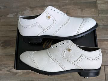 FootJoy style 51409: Spiked saddle, colored patent with white shrunken calf. Pebbled White Brogue
